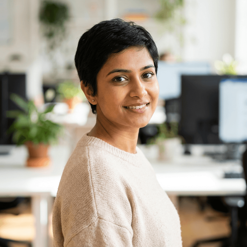 Priya Sharma in a cozy café with a notebook open